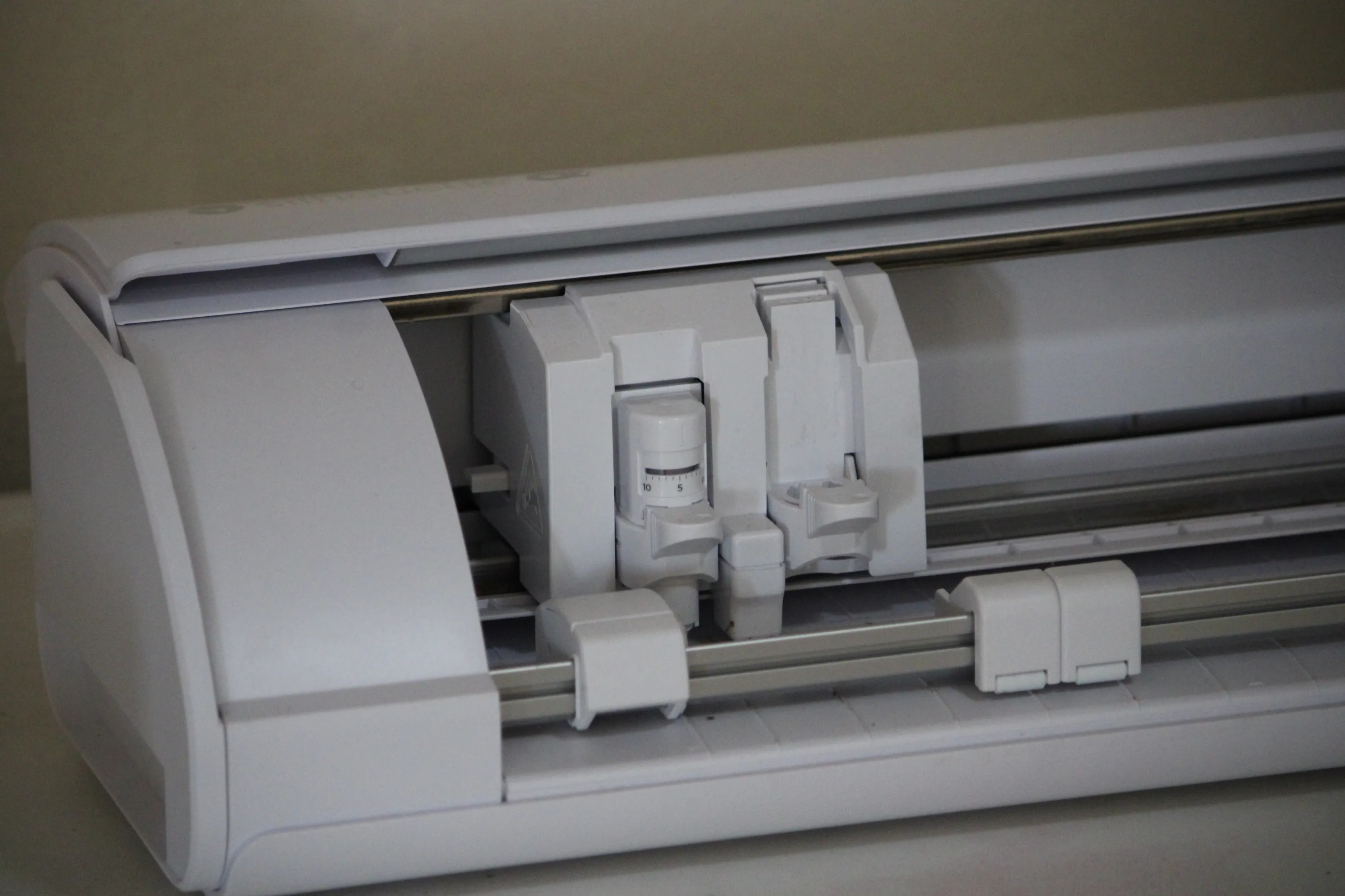 Vinyl cutting machine mid-cut, close up of the cutting head